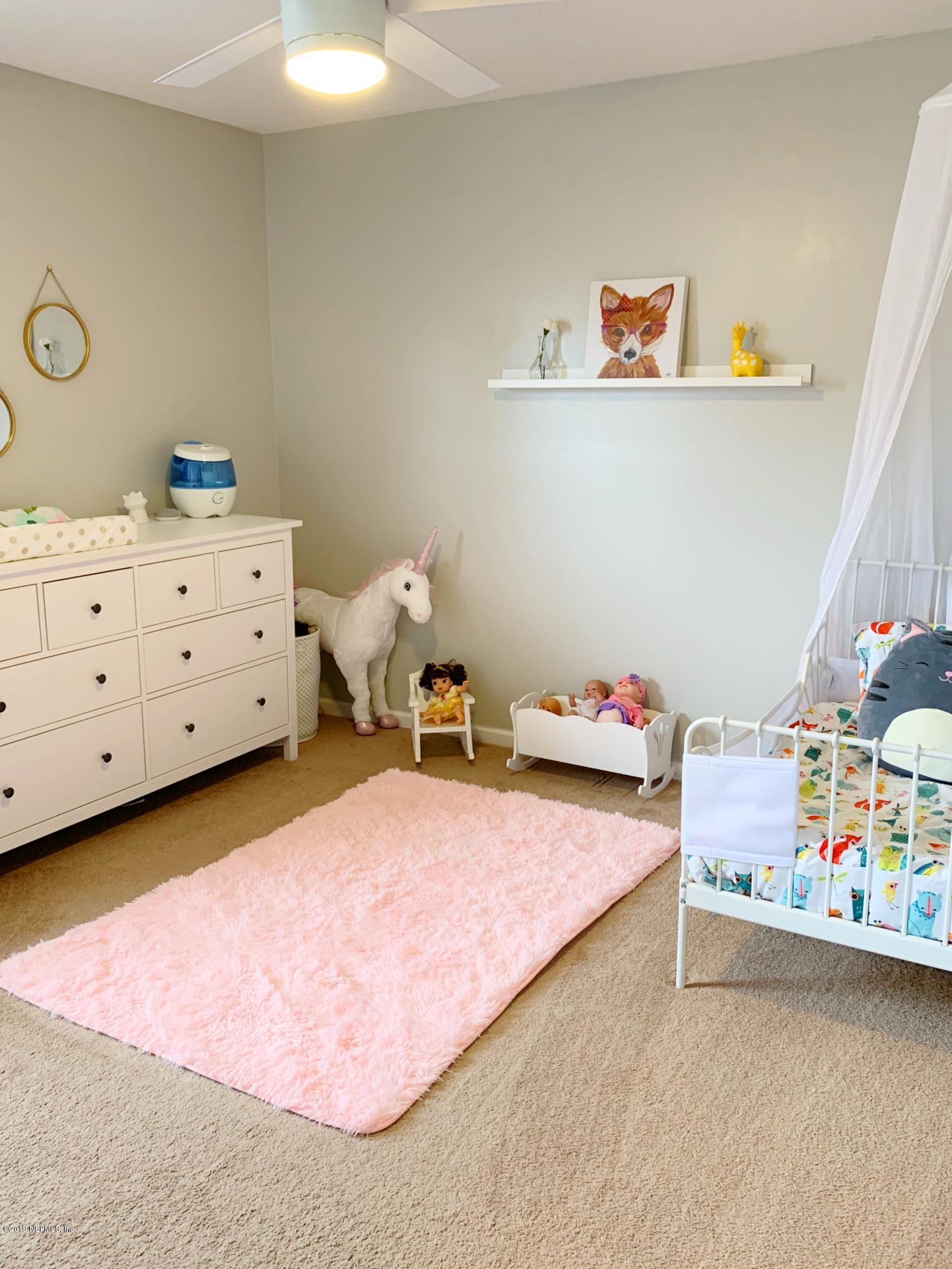 10345 Sugar Grove Road Jacksonville, FL 32221 - Photo 29 of 36 a bedroom with a bed and a dresser