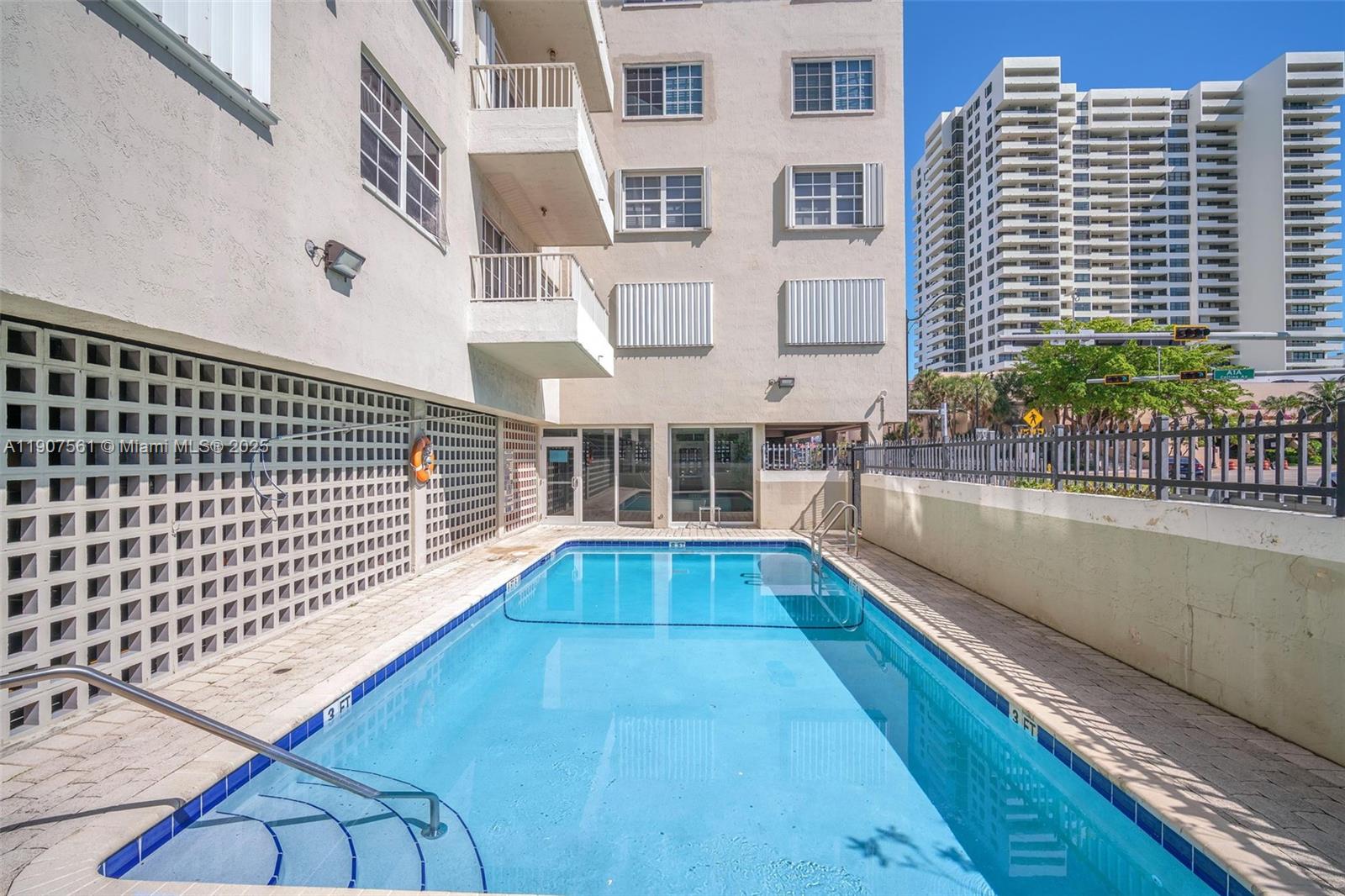 2600 Collins Avenue, Unit 206 Miami Beach, FL 33140 - Photo 21 of 25 a view of balcony with a floor to ceiling window and wooden floor