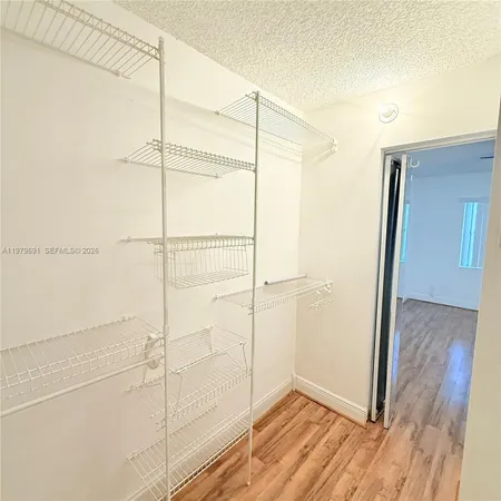 a view of an house with backyard and a garden