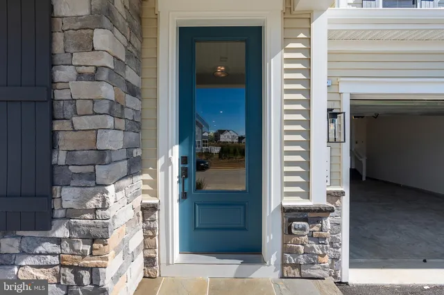 a kitchen with stainless steel appliances a sink stove and refrigerator