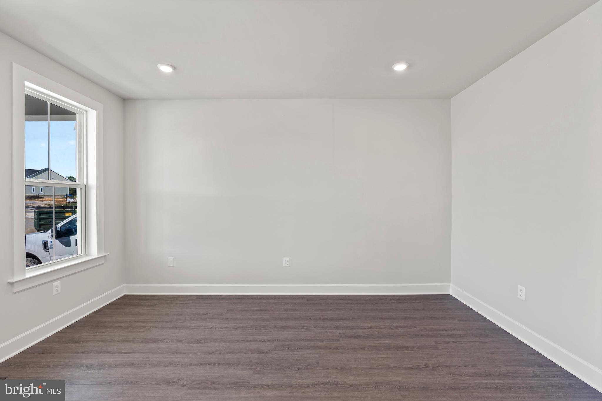 1448 Lavender Cliff Way Odenton, MD 21113 - Photo 15 of 94 a view of an empty room with wooden floor and a window