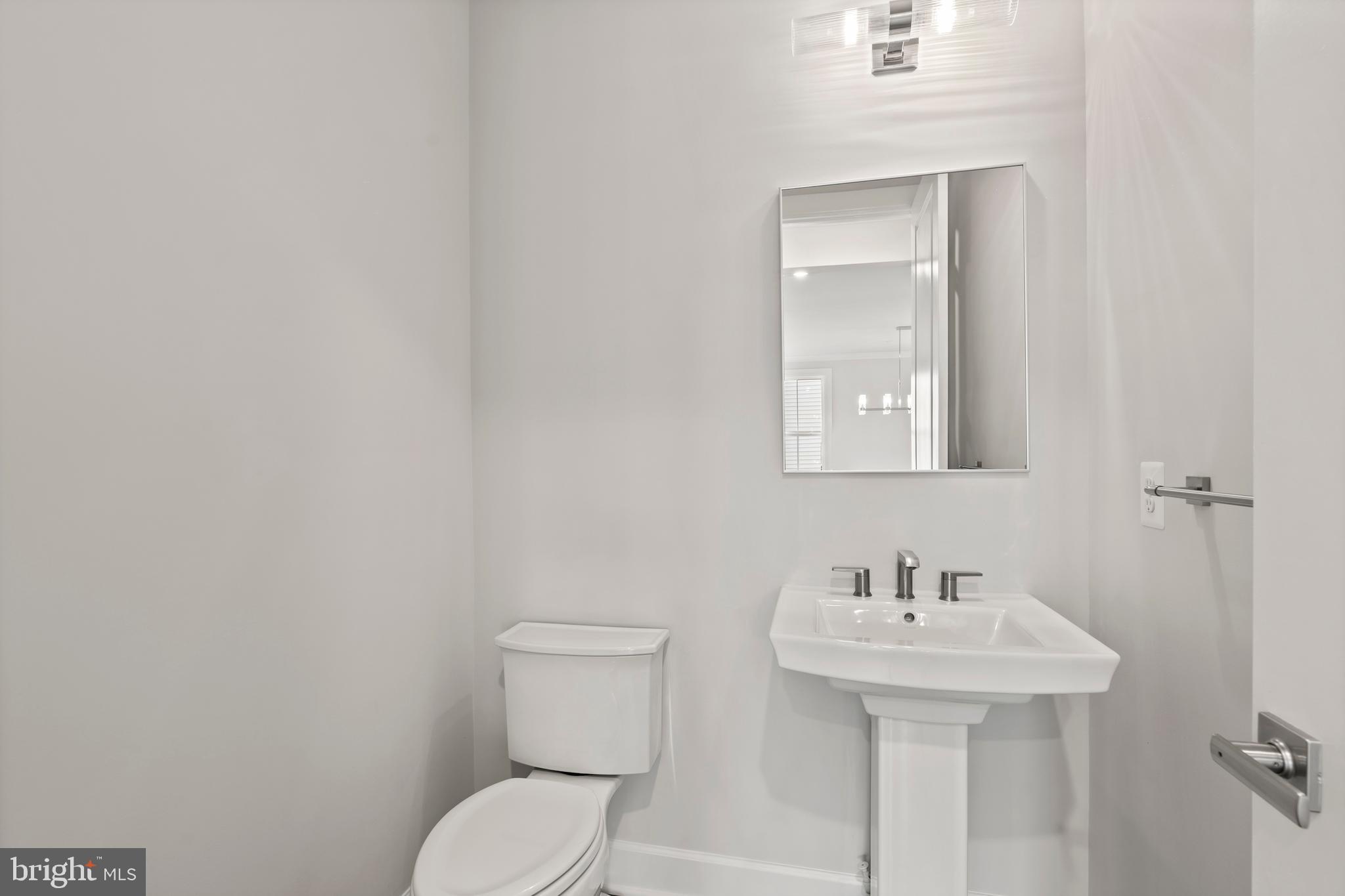 1448 Lavender Cliff Way Odenton, MD 21113 - Photo 19 of 94 a bathroom with a sink a toilet and mirror