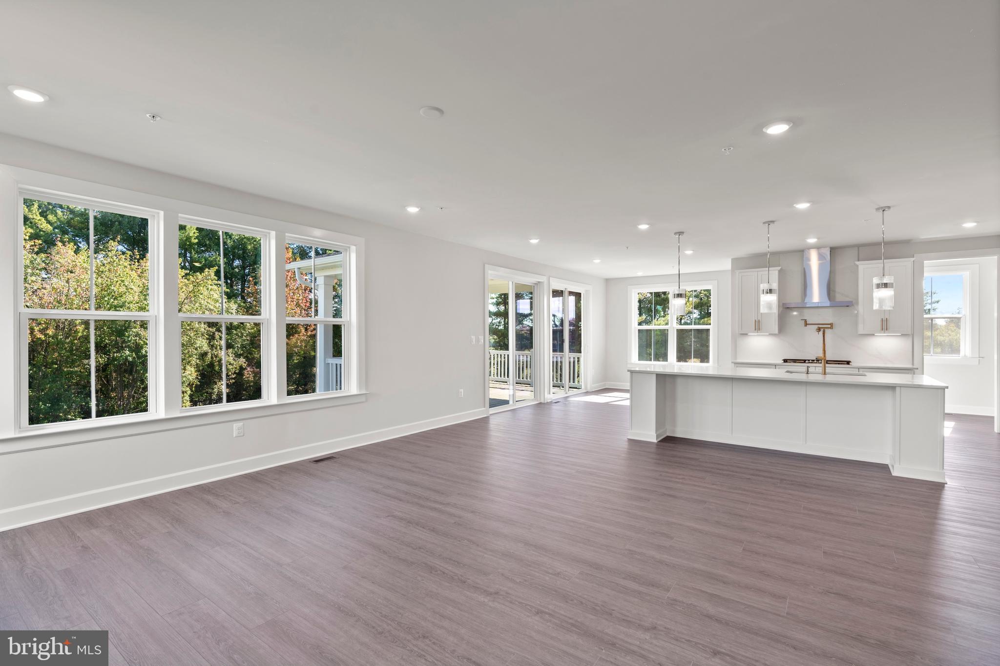 1448 Lavender Cliff Way Odenton, MD 21113 - Photo 23 of 94 a view of an empty room with wooden floor and a window