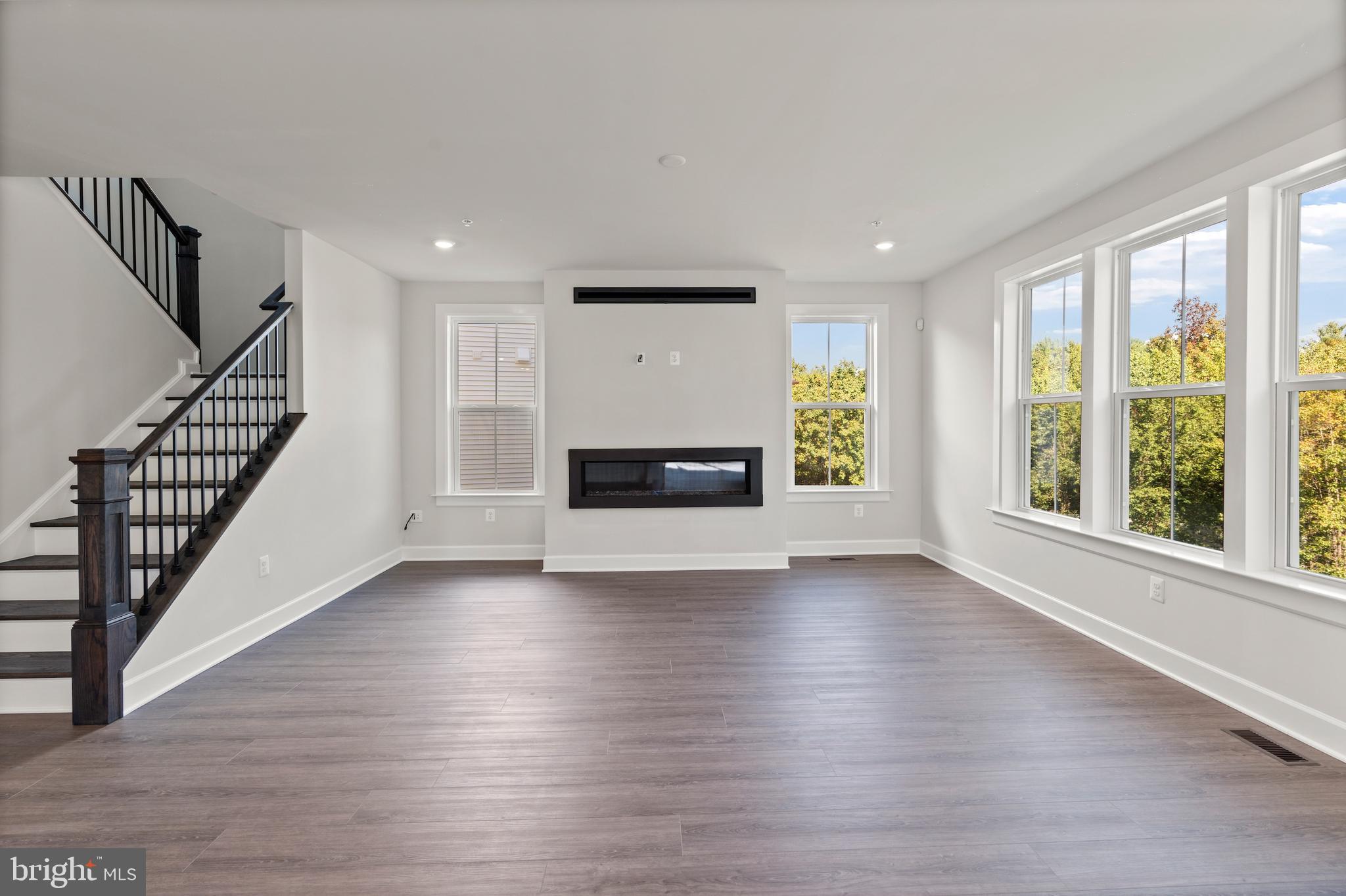 1448 Lavender Cliff Way Odenton, MD 21113 - Photo 24 of 94 a view of an empty room with wooden floor and a window