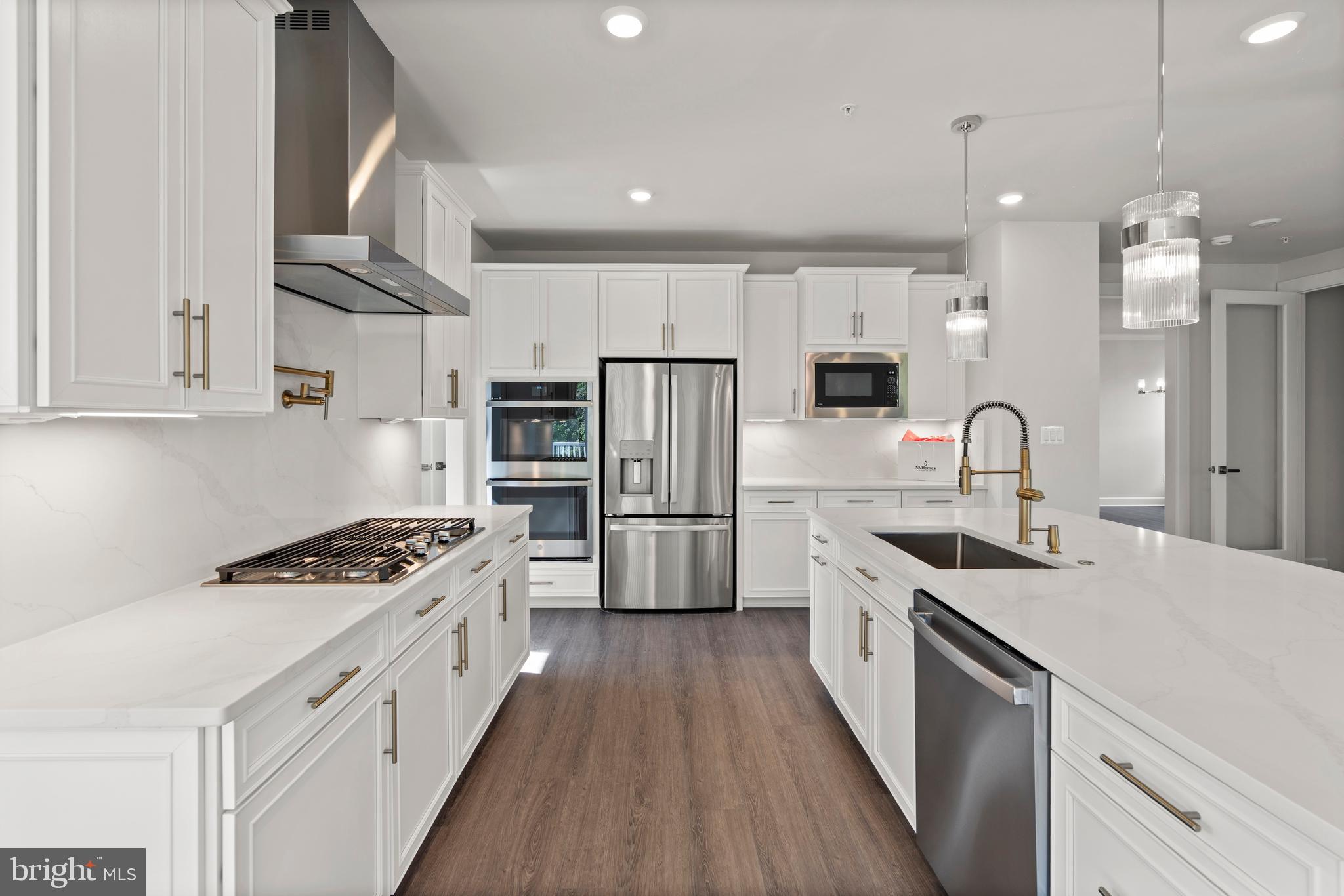 1448 Lavender Cliff Way Odenton, MD 21113 - Photo 30 of 94 a kitchen with stainless steel appliances a sink stove and refrigerator