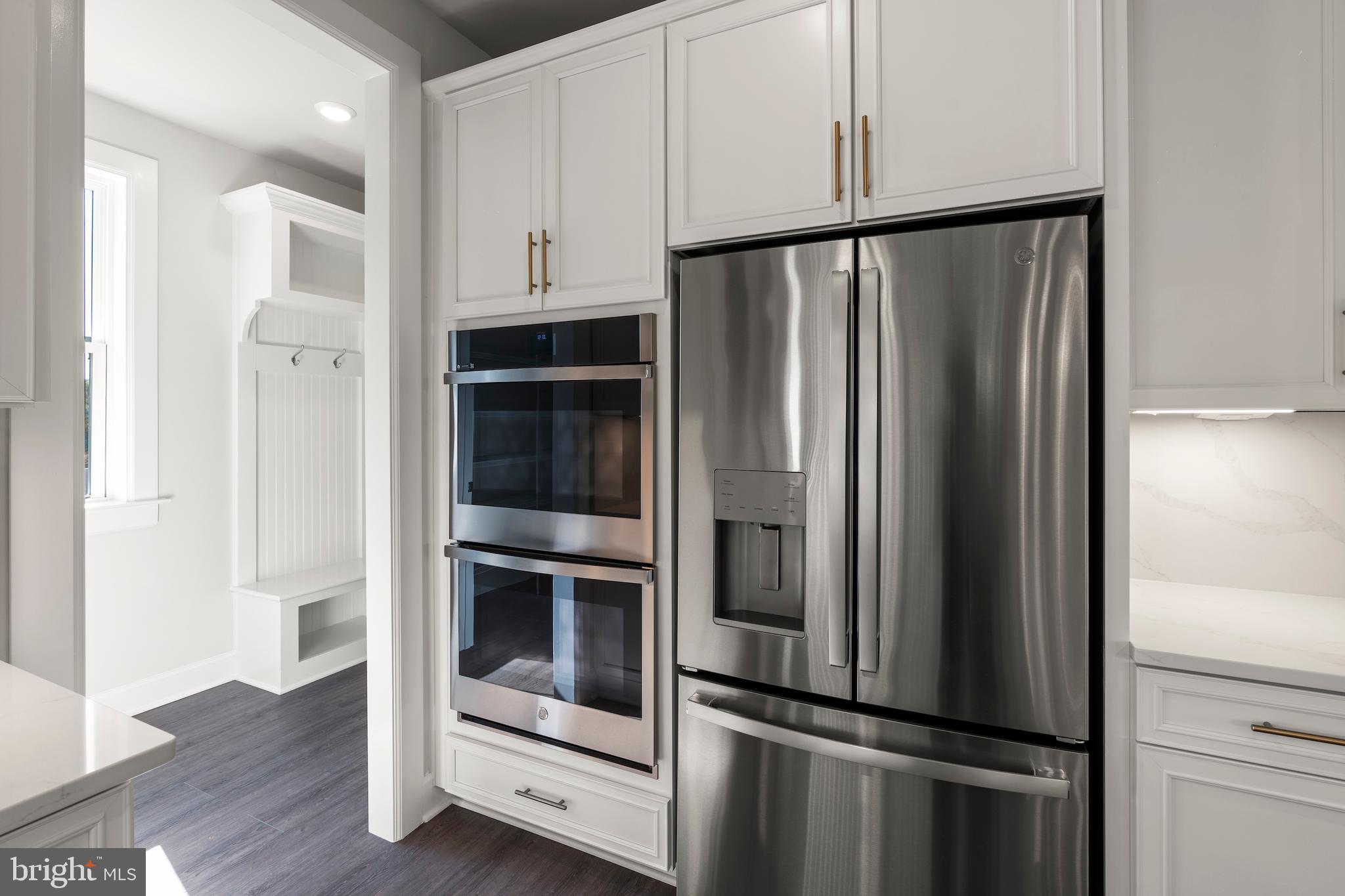 1448 Lavender Cliff Way Odenton, MD 21113 - Photo 32 of 94 a metallic refrigerator freezer and a stove top oven