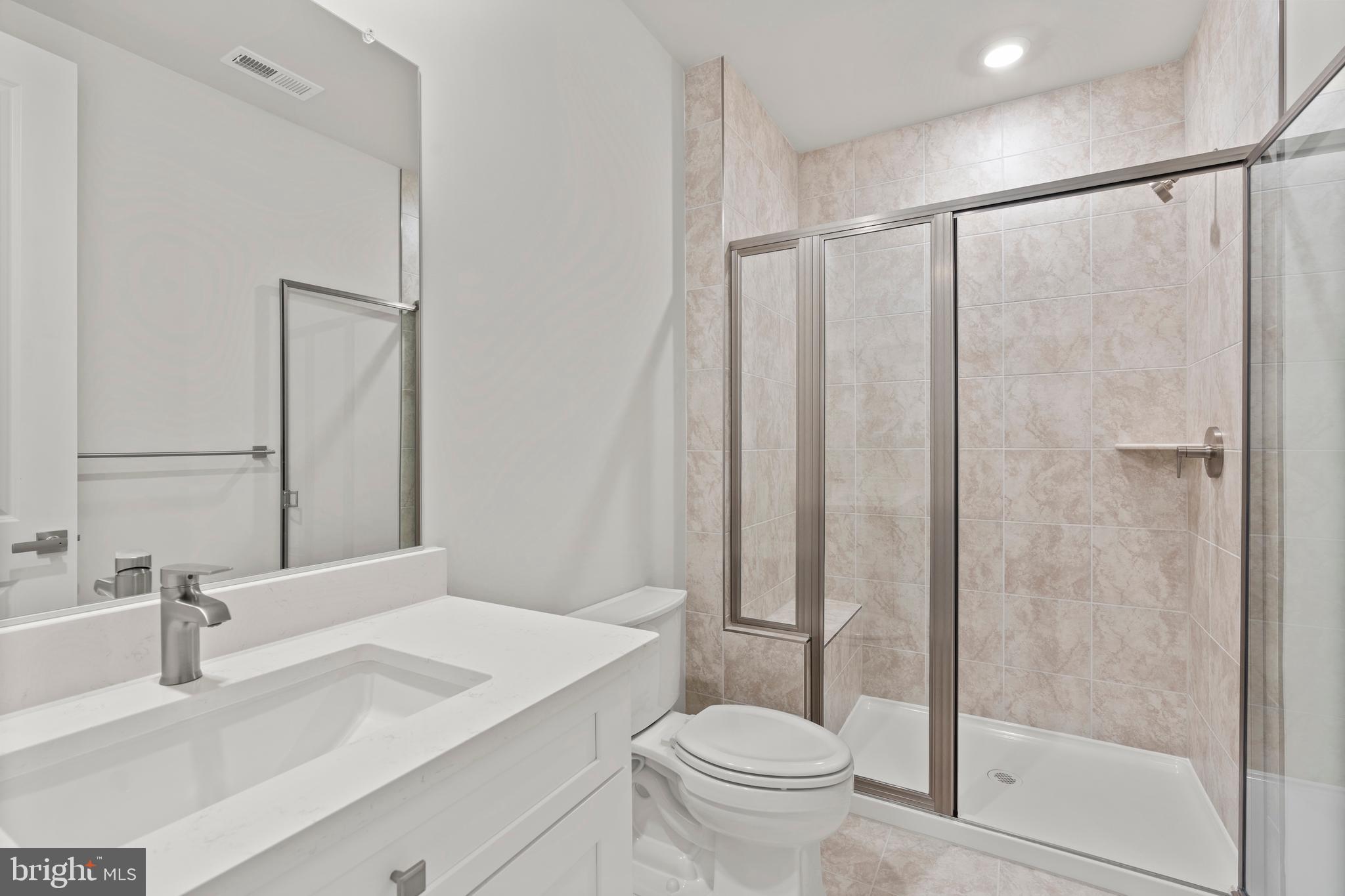 1448 Lavender Cliff Way Odenton, MD 21113 - Photo 39 of 94 a bathroom with a sink a toilet and shower