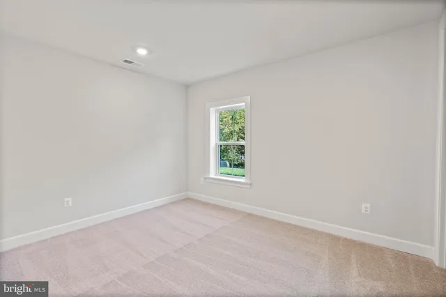 a view of livingroom with hardwood floor and hallway