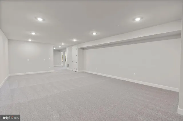 a view of balcony with wooden floor & fence