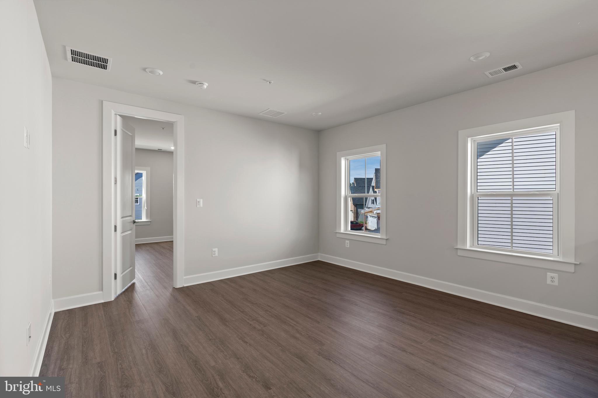 1448 Lavender Cliff Way Odenton, MD 21113 - Photo 54 of 94 an empty room with wooden floor and windows
