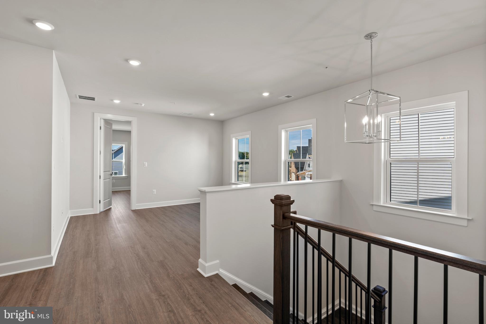 1448 Lavender Cliff Way Odenton, MD 21113 - Photo 56 of 94 a view of a kitchen with wooden floor and a window