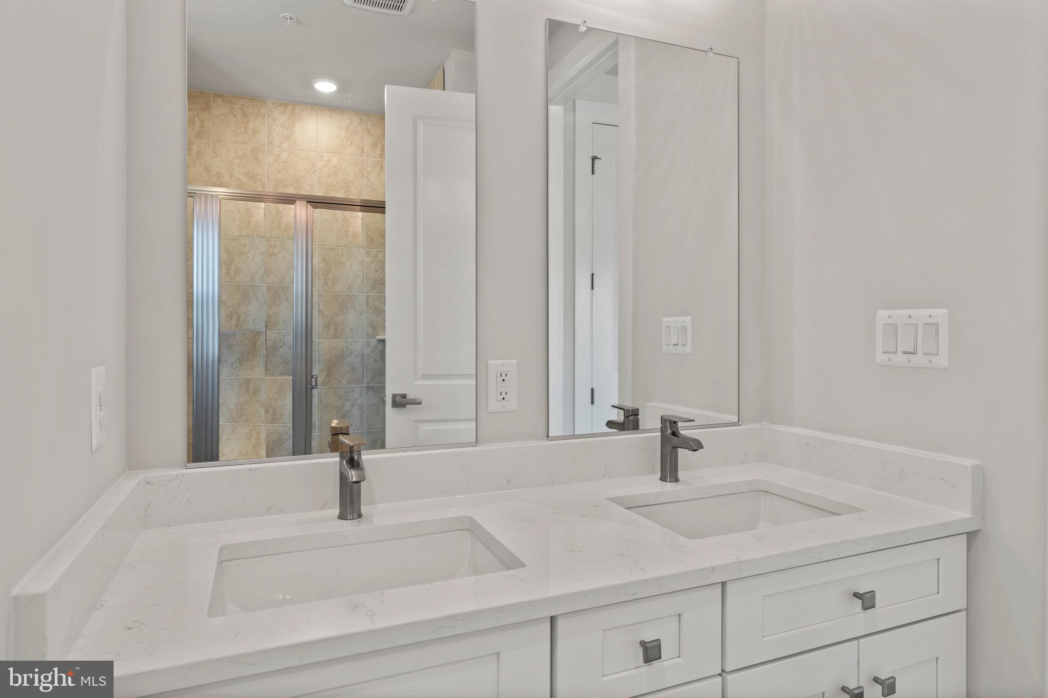 1448 Lavender Cliff Way Odenton, MD 21113 - Photo 65 of 94 a bathroom with a sink and a mirror