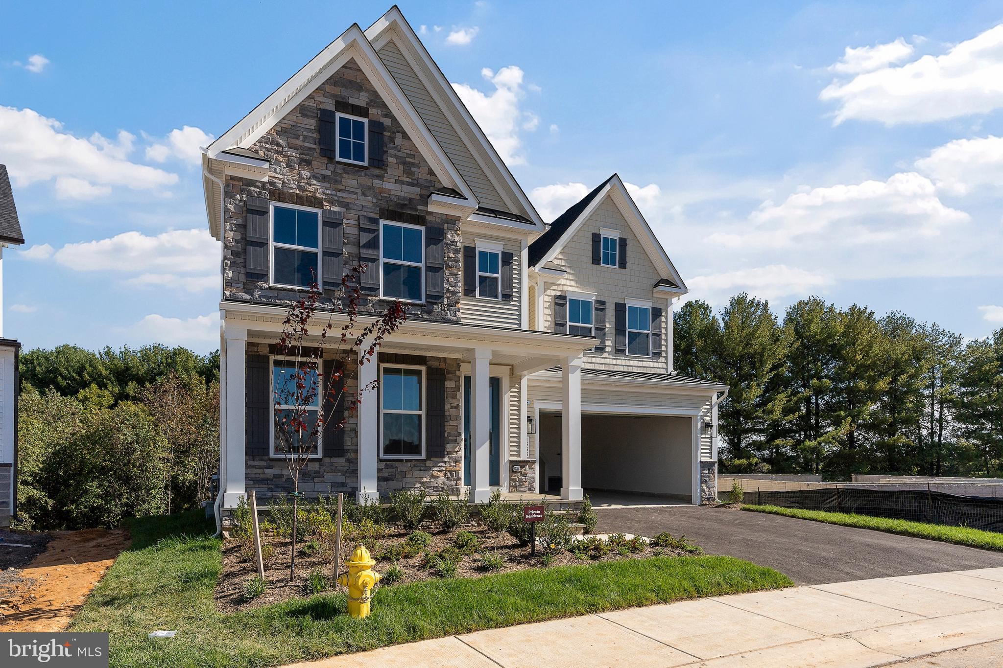 1448 Lavender Cliff Way Odenton, MD 21113 - Photo 7 of 94 a front view of house with yard and green space