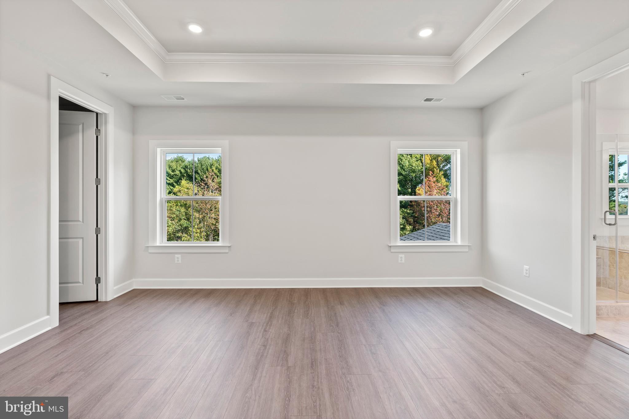 1448 Lavender Cliff Way Odenton, MD 21113 - Photo 76 of 94 an empty room with wooden floor and windows