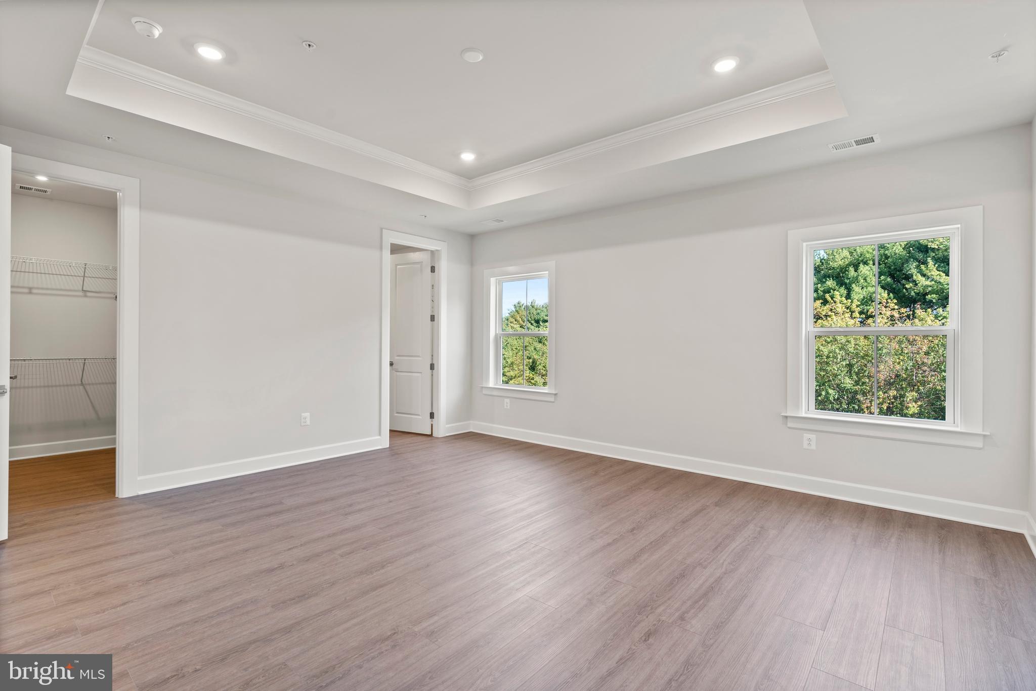 1448 Lavender Cliff Way Odenton, MD 21113 - Photo 77 of 94 an empty room with wooden floor and windows