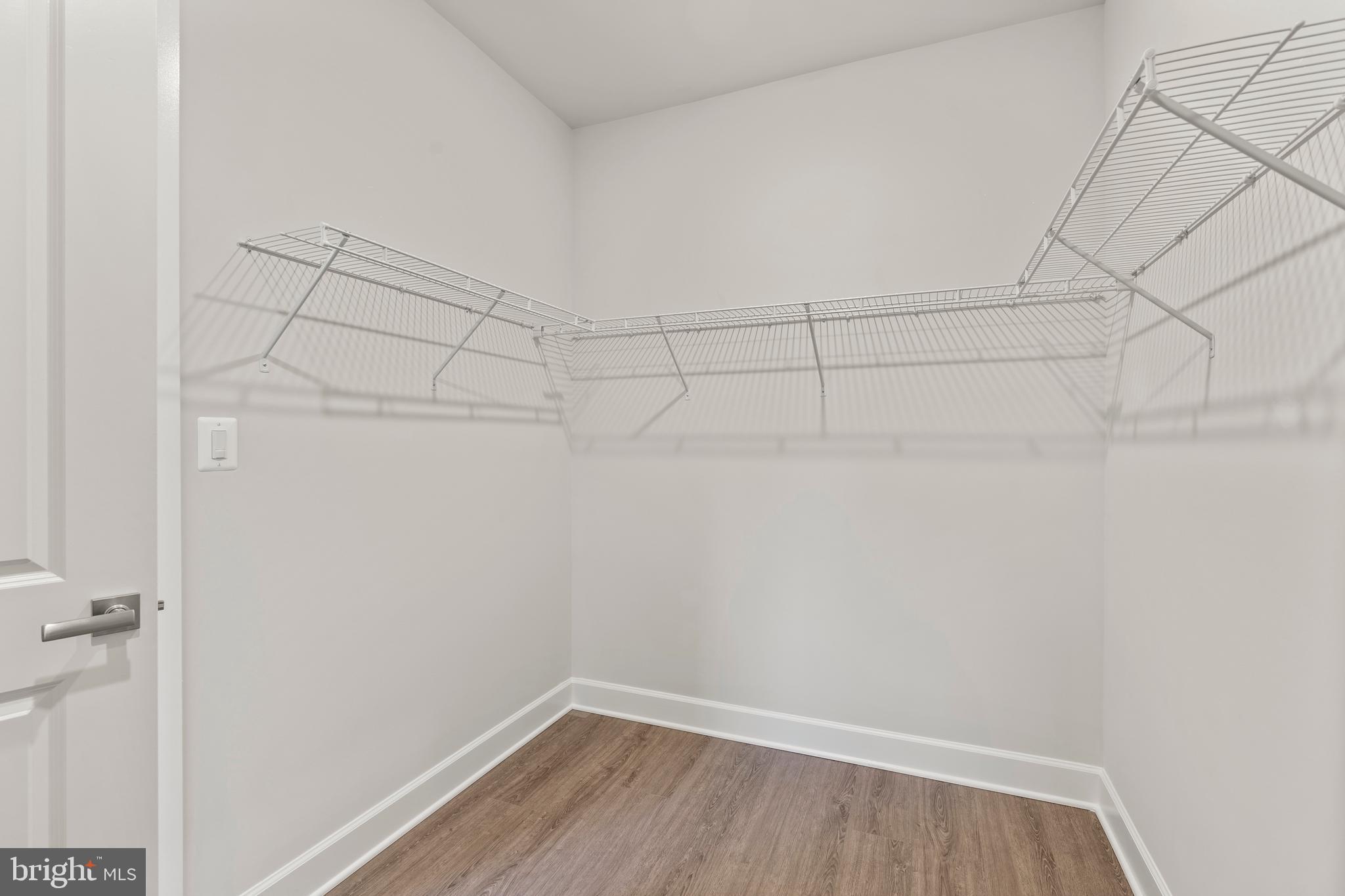 1448 Lavender Cliff Way Odenton, MD 21113 - Photo 82 of 94 a view of a room with racks on the wall