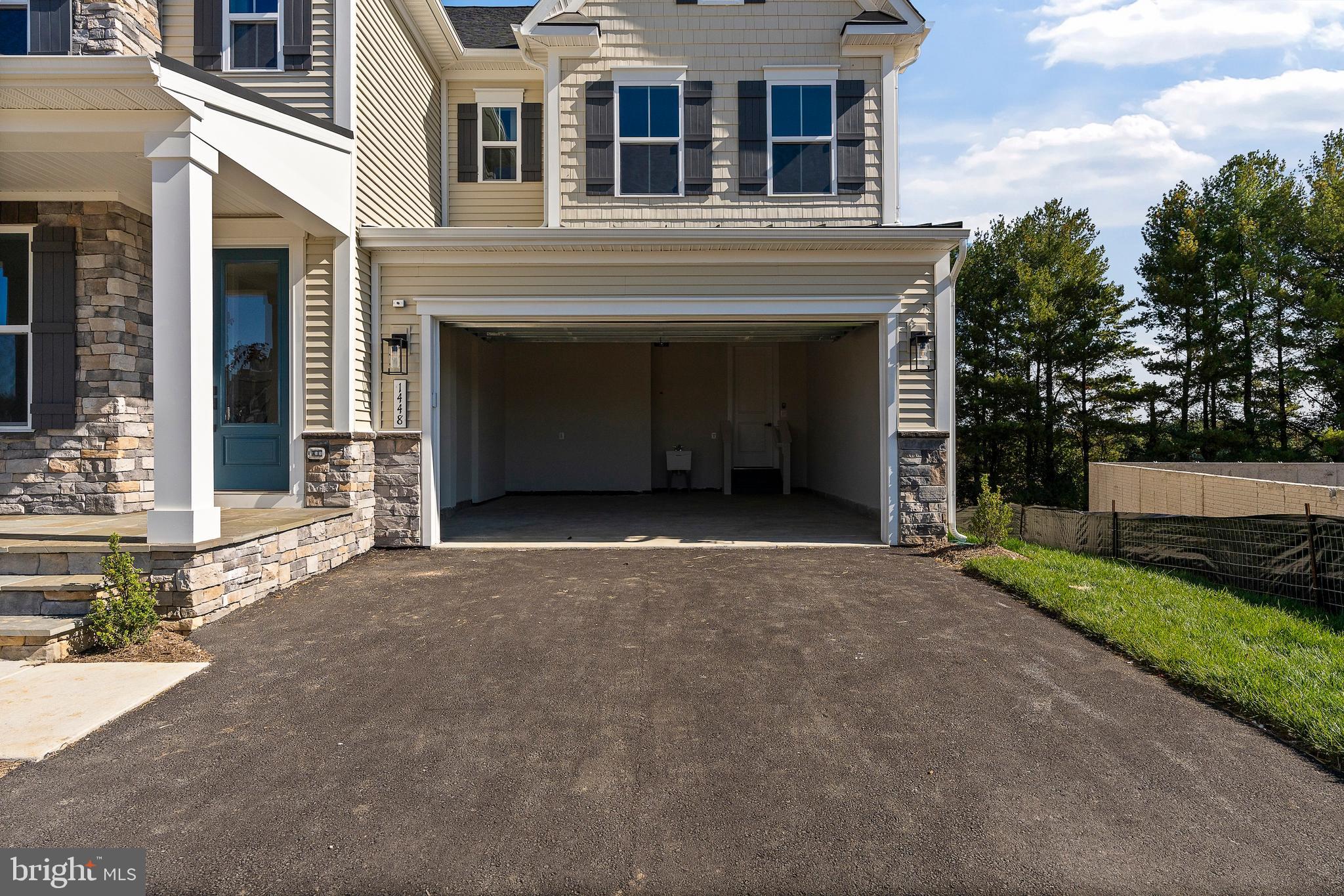 1448 Lavender Cliff Way Odenton, MD 21113 - Photo 9 of 94 a view of a building with a yard