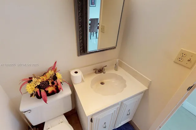 a bathroom with a sink and mirror