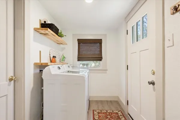 a bathroom with a sink and mirror with toilet