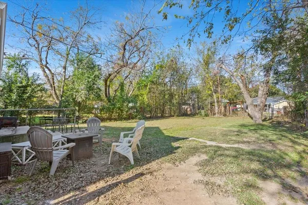 a view of a chairs and table in the garden