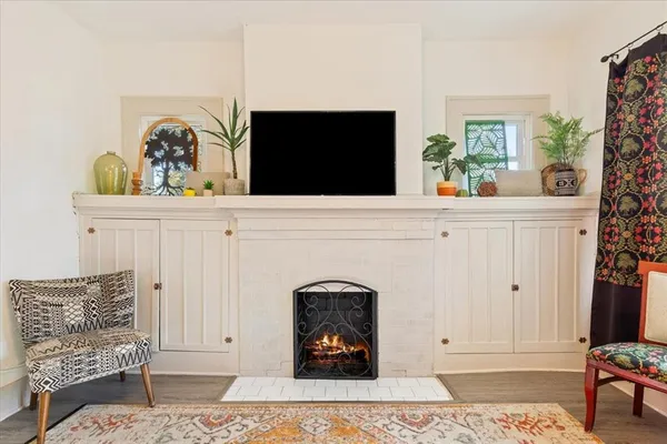 a living room with furniture and flat screen tv