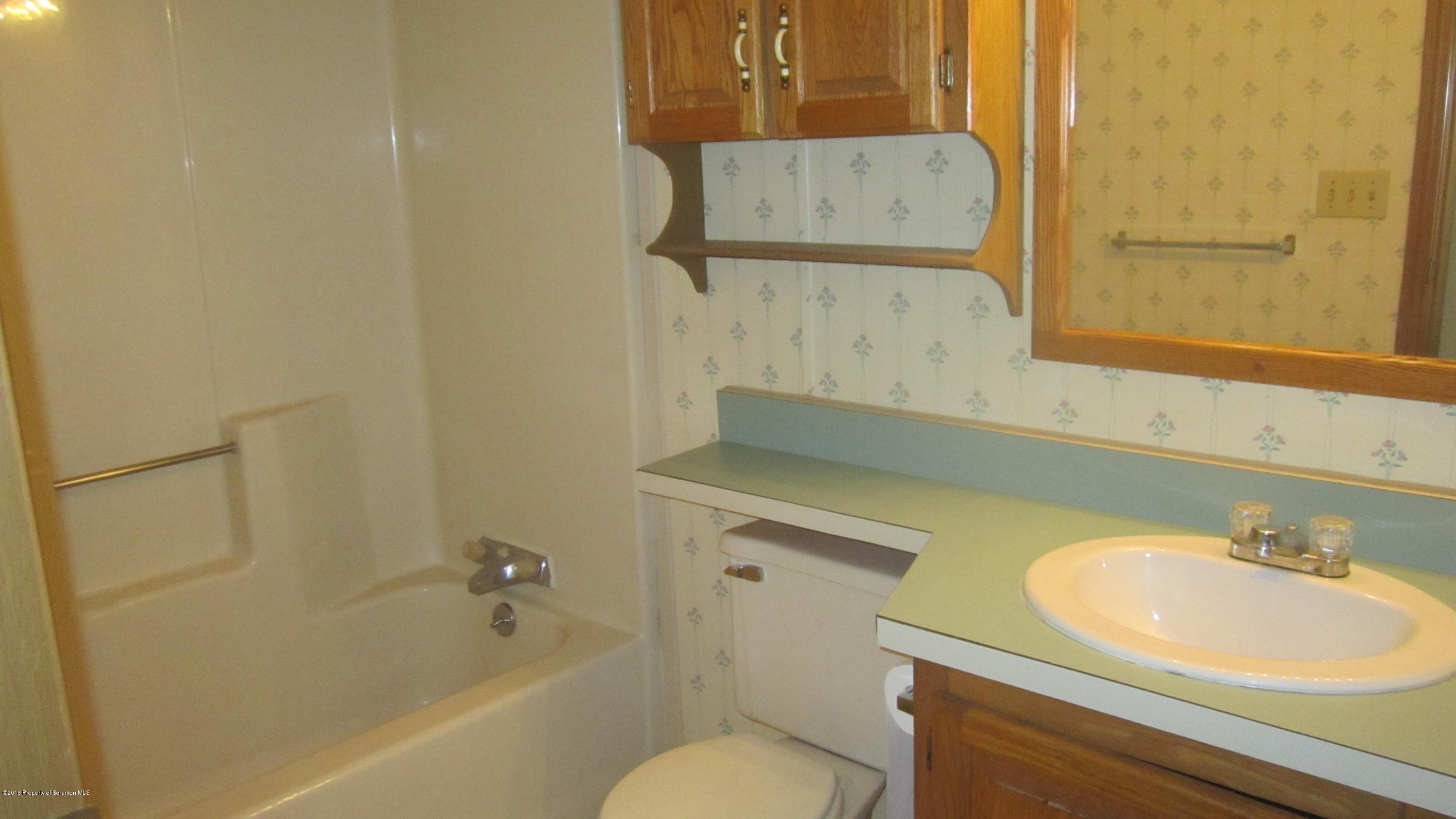 325 Rail Road Nicholson, PA 18446 - Photo 15 of 15 a bathroom with a sink and a mirror