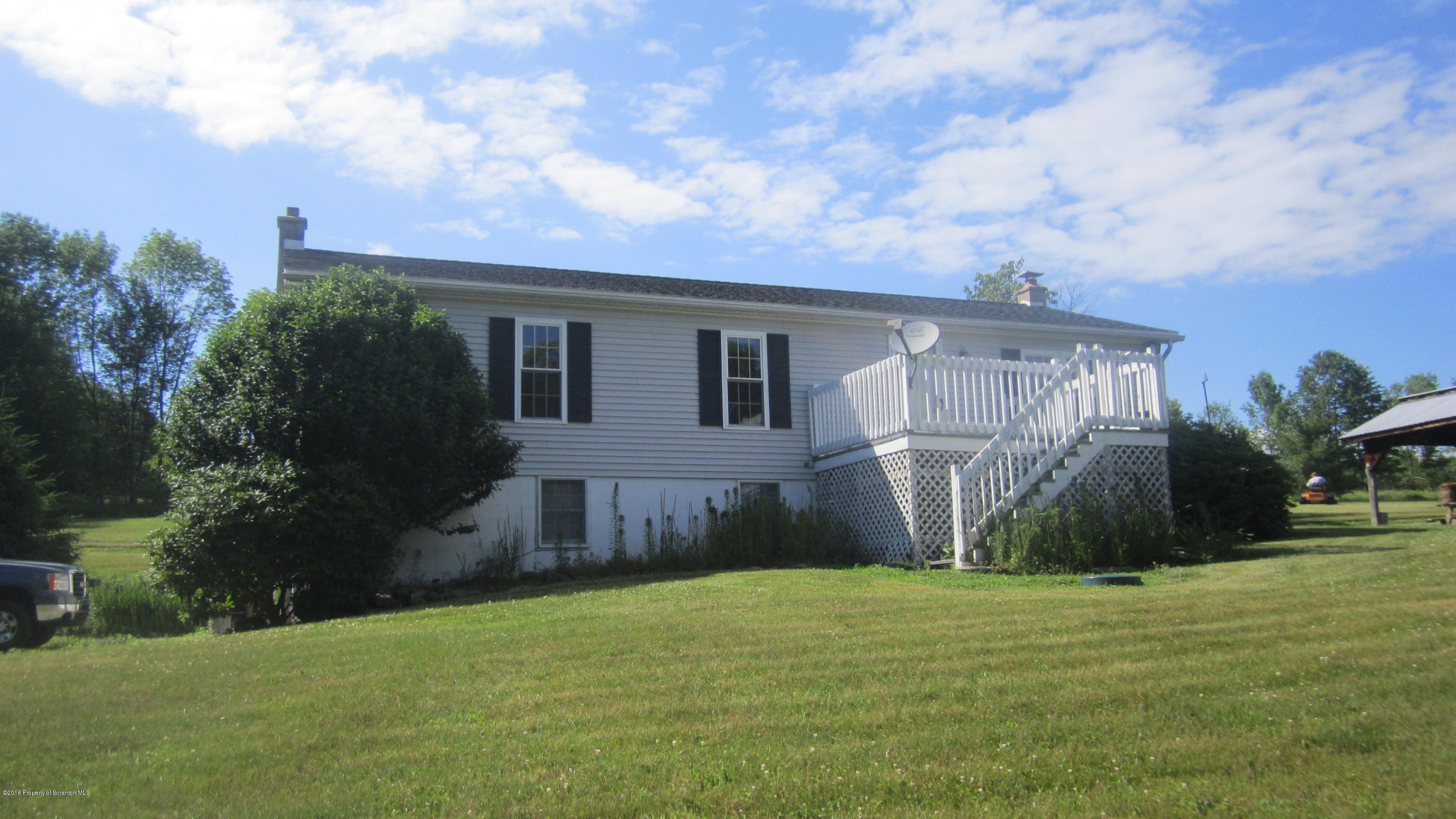 325 Rail Road Nicholson, PA 18446 - Photo 2 of 15 a backyard of a house with lots of green space