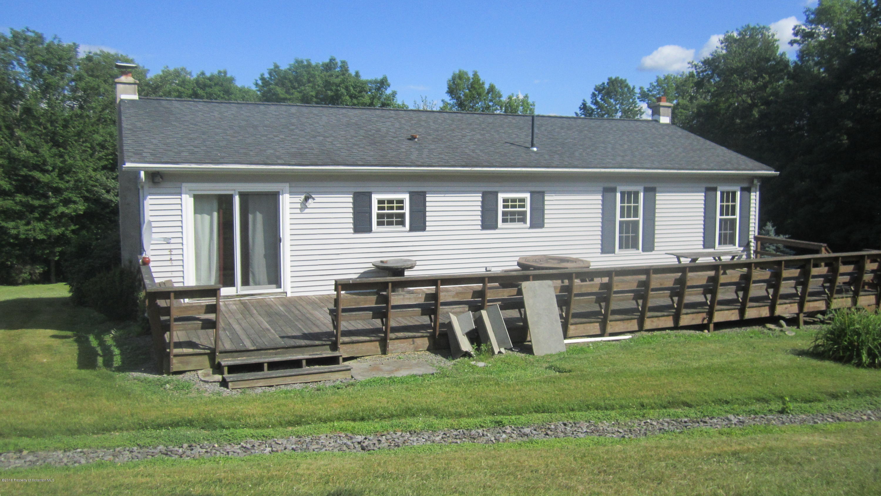 325 Rail Road Nicholson, PA 18446 - Photo 6 of 15 a backyard of a house with table and chairs