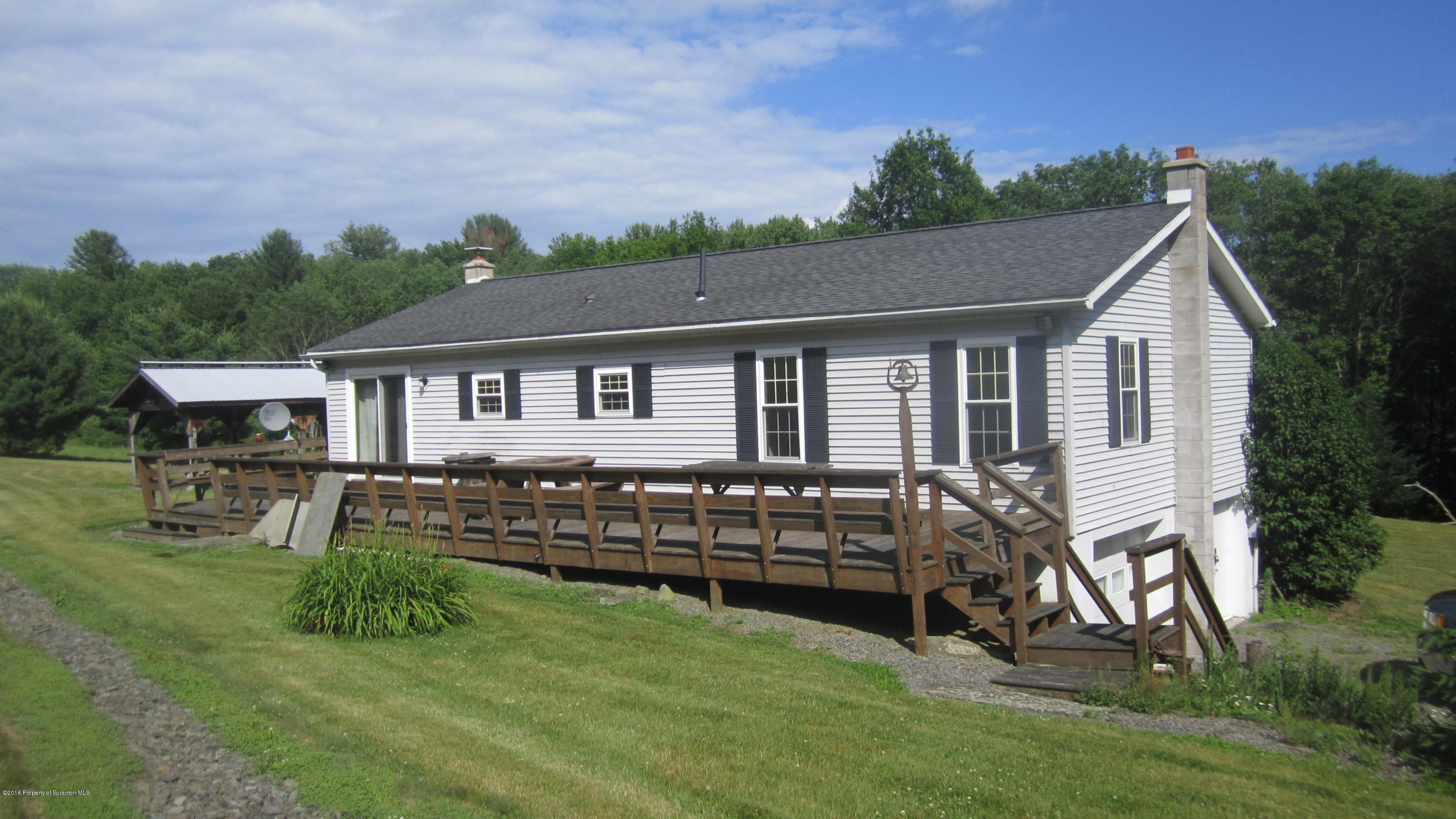 325 Rail Road Nicholson, PA 18446 - Photo 7 of 15 a view of a house with a yard porch and sitting area