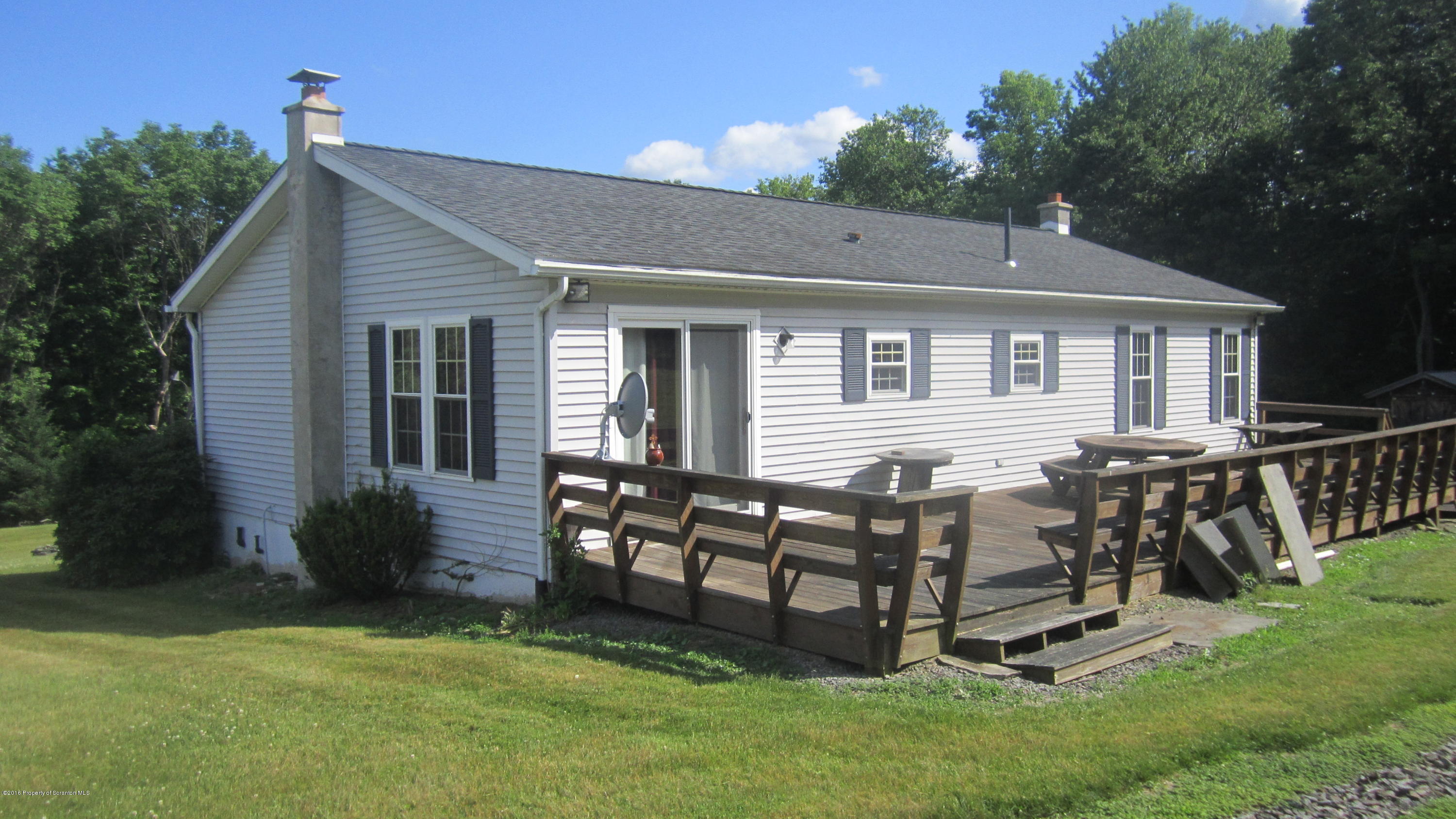 325 Rail Road Nicholson, PA 18446 - Photo 8 of 15 a view of a house with a yard and sitting area