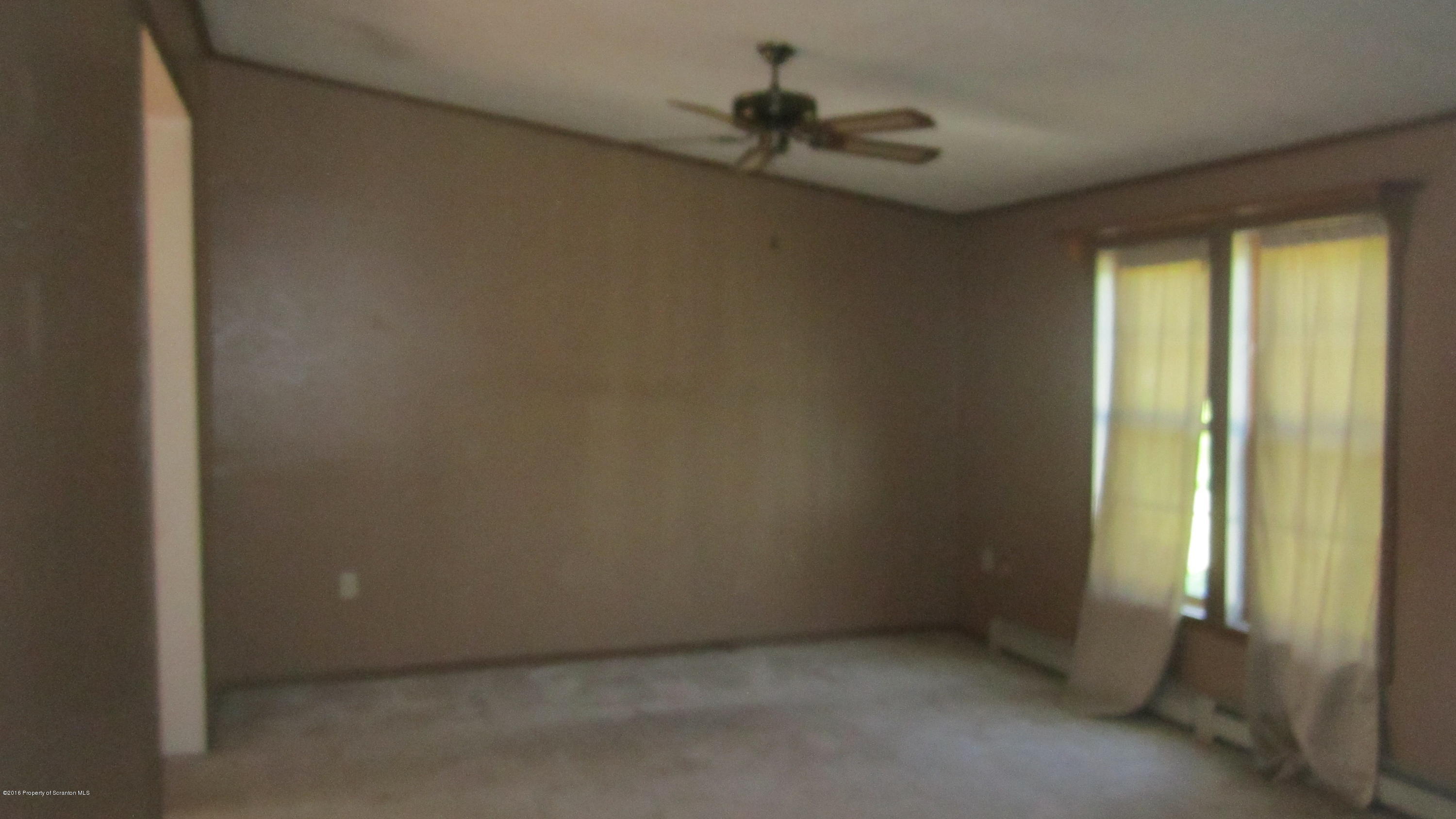 325 Rail Road Nicholson, PA 18446 - Photo 10 of 15 an empty room with a window