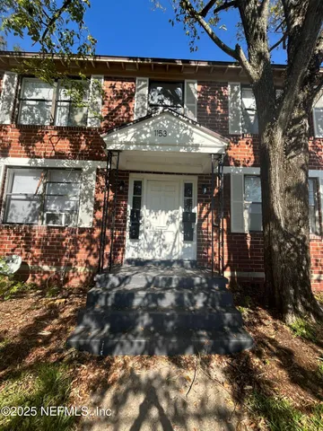 a view of a chairs and table in a patio
