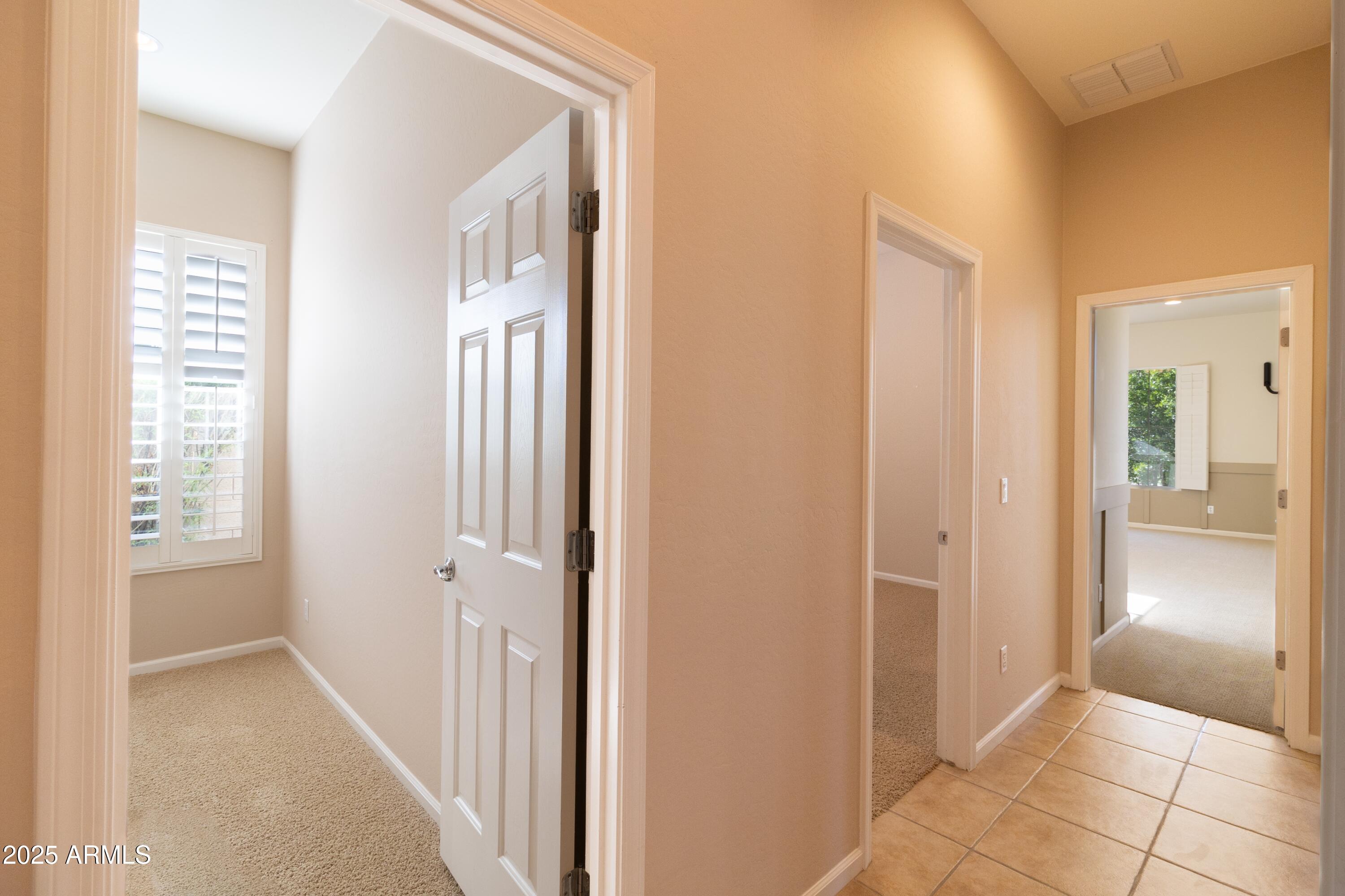 4241 East Andre Avenue Gilbert, AZ 85298 - Photo 20 of 39 a view of a hallway to rooms and stairs