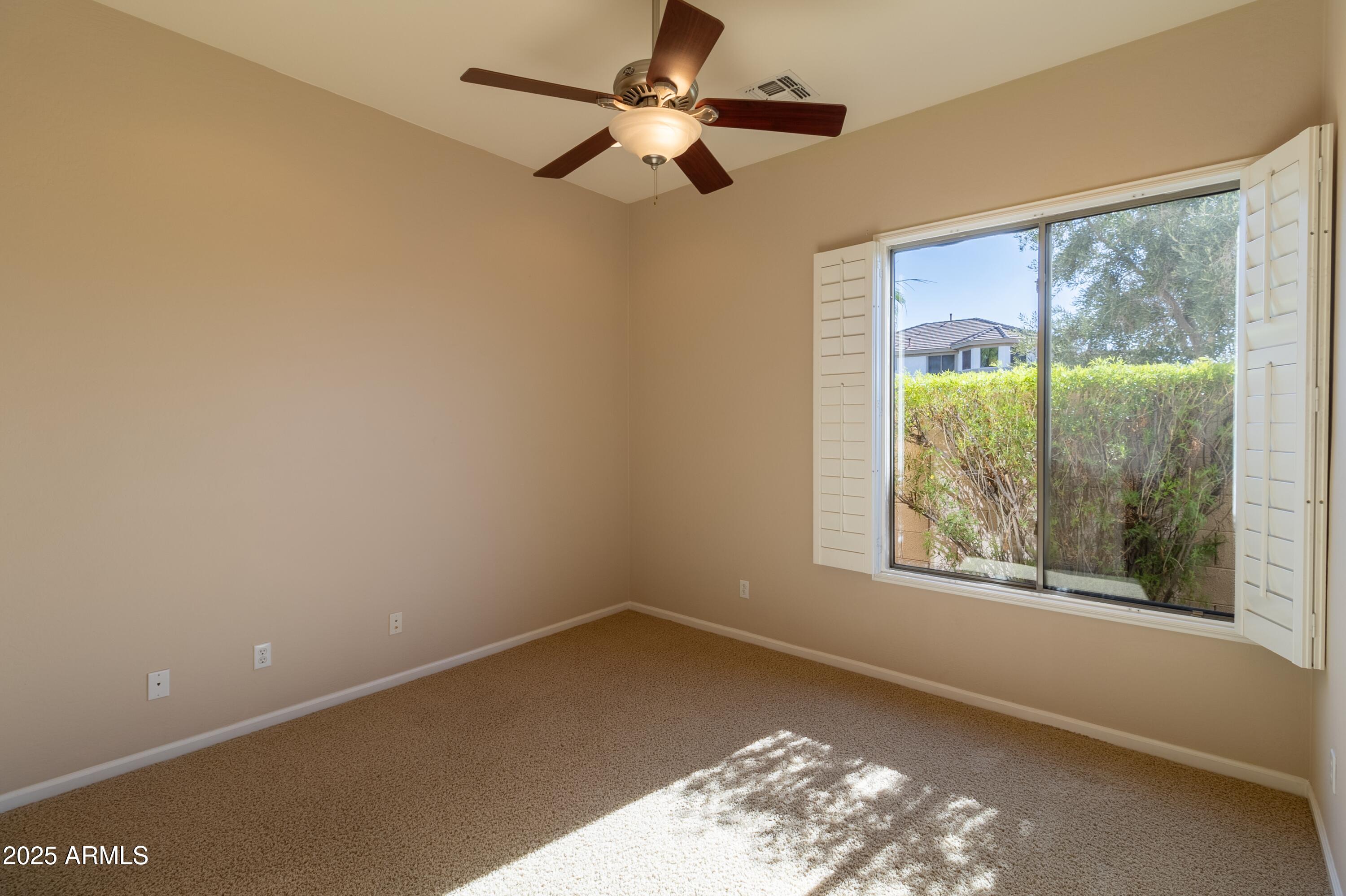 4241 East Andre Avenue Gilbert, AZ 85298 - Photo 21 of 39 an empty room with a window