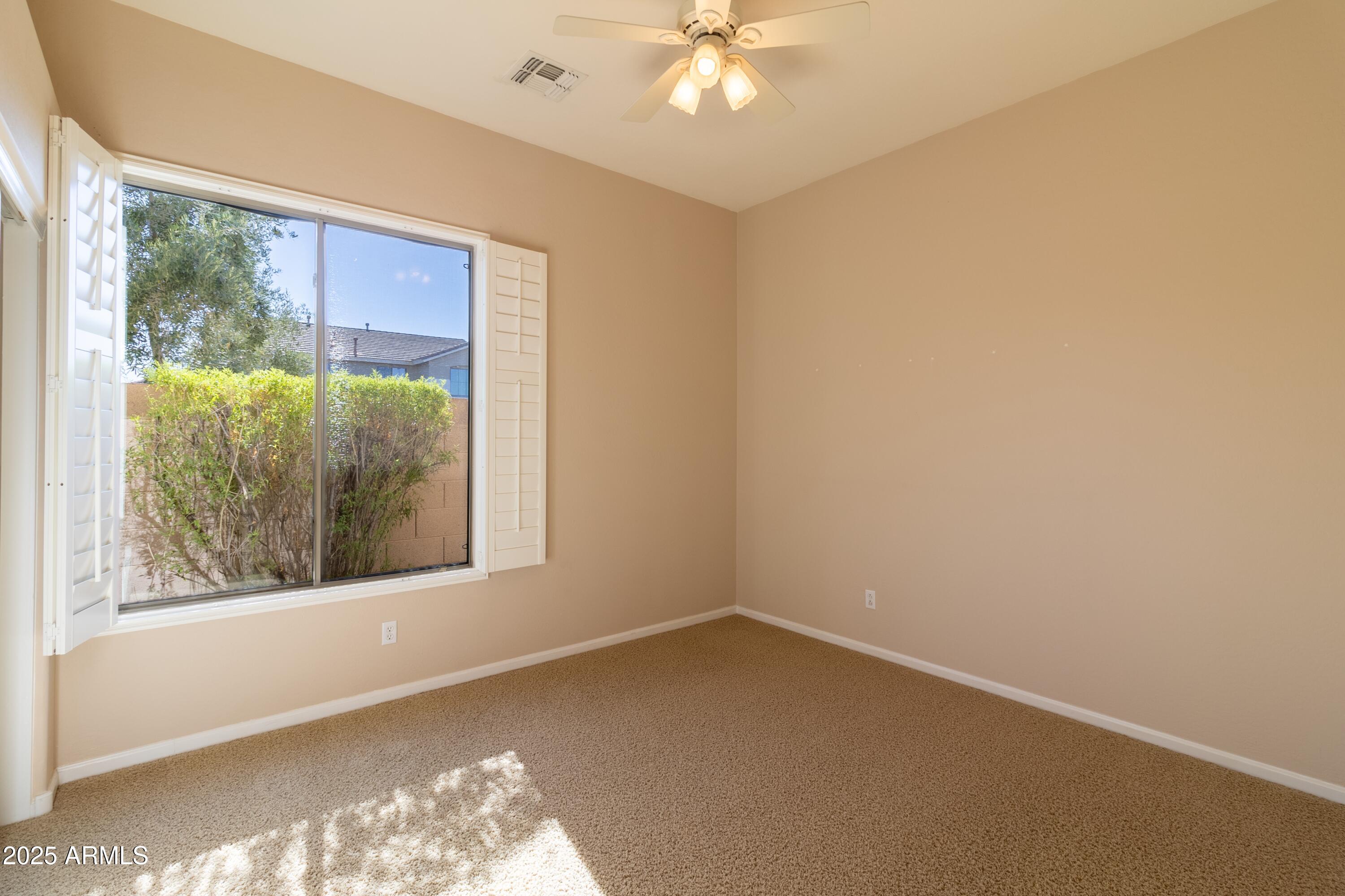 4241 East Andre Avenue Gilbert, AZ 85298 - Photo 24 of 39 an empty room with a window
