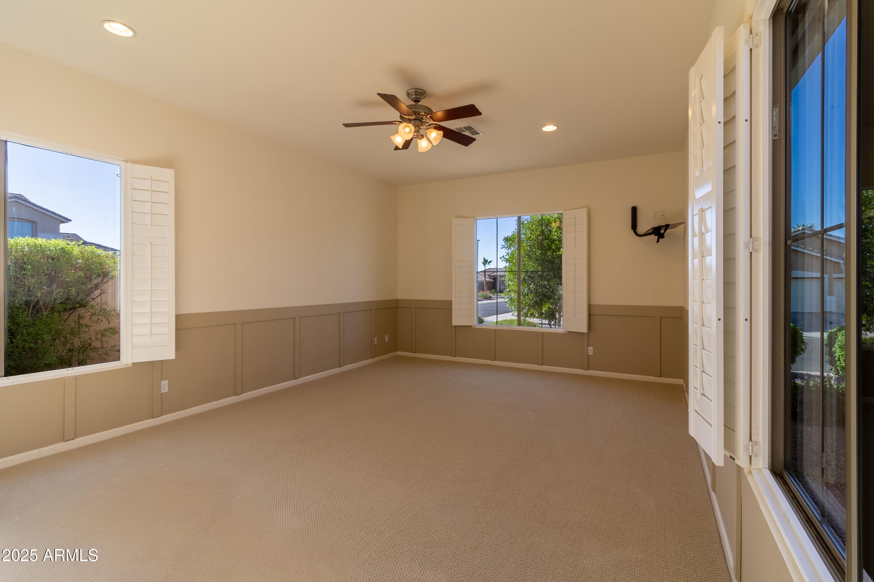 4241 East Andre Avenue Gilbert, AZ 85298 - Photo 26 of 39 an empty room with windows and closet