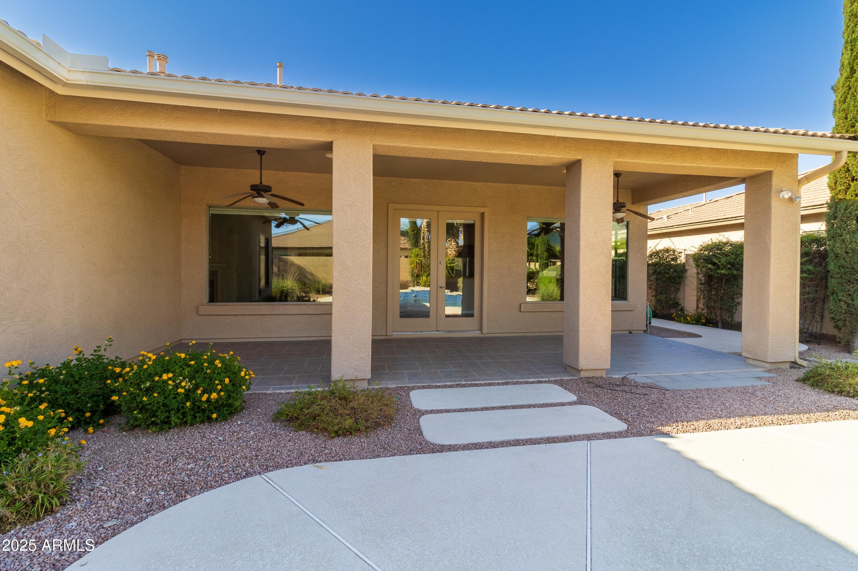 4241 East Andre Avenue Gilbert, AZ 85298 - Photo 35 of 39 a front view of a house with a porch