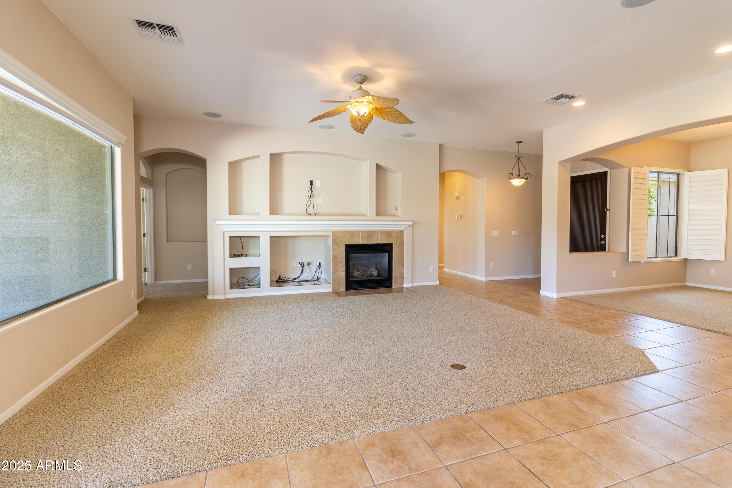 4241 East Andre Avenue Gilbert, AZ 85298 - Photo 6 of 39 a view of a livingroom with a fireplace