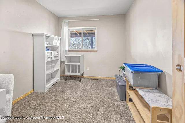 a view of a room with wooden walls