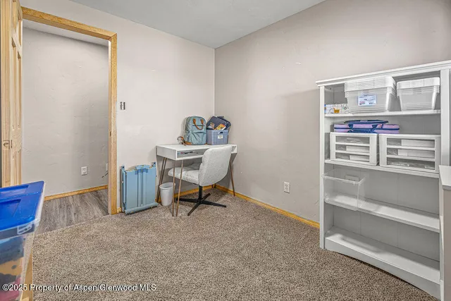 a bed room with a bed and a large window