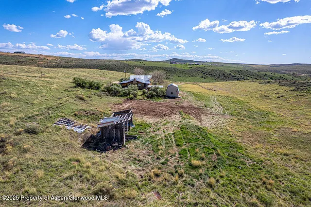 a view of a backyard of the house
