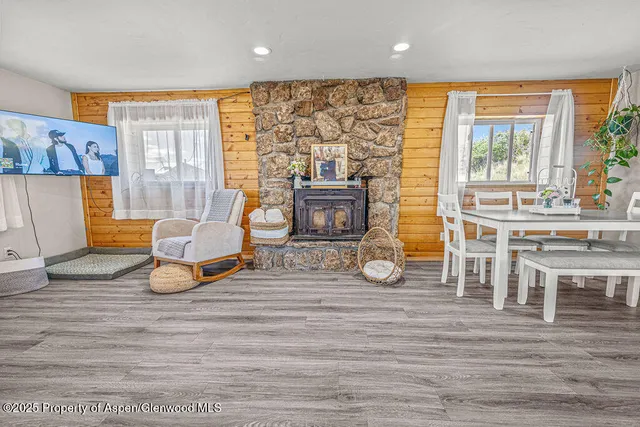 a room with lots of wooden furniture and a wooden floor