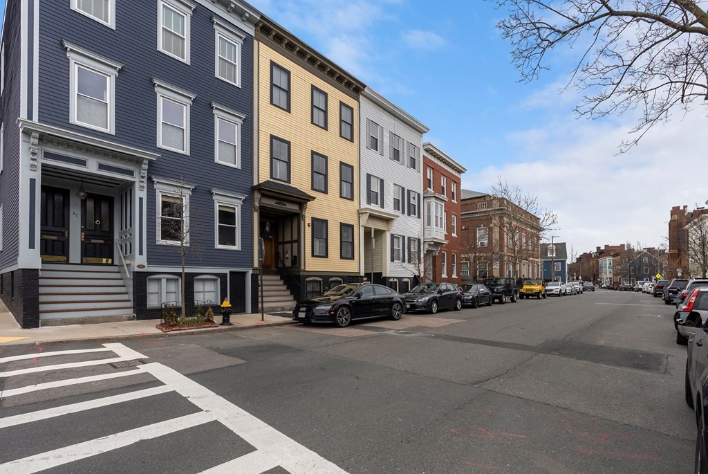87 High Street, Unit 1 Boston, MA 02129 - Photo 18 of 18 a city street lined with buildings and cars