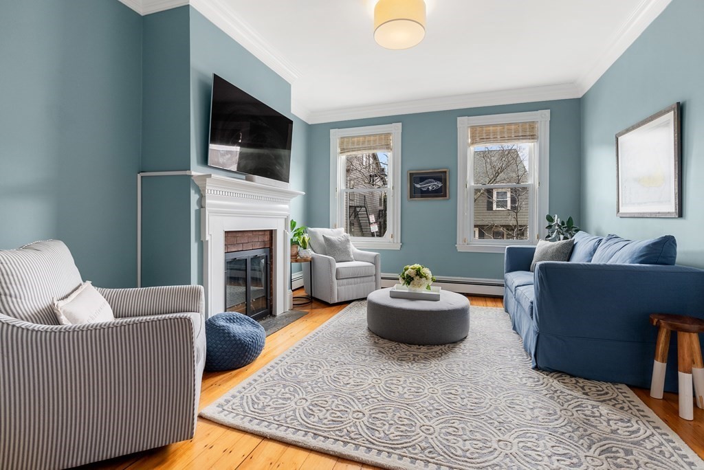 87 High Street, Unit 1 Boston, MA 02129 - Photo 2 of 18 a living room with fireplace furniture and a flat screen tv