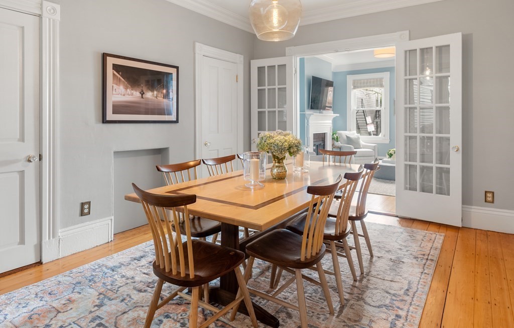 87 High Street, Unit 1 Boston, MA 02129 - Photo 6 of 18 a dining room with furniture and wooden floor