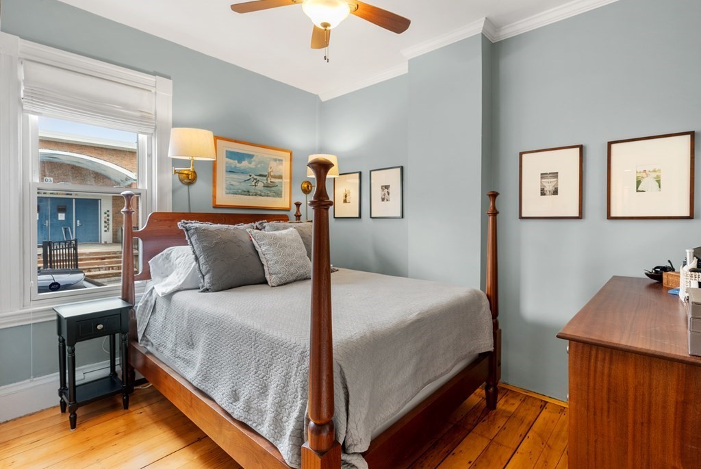 87 High Street, Unit 1 Boston, MA 02129 - Photo 7 of 18 a bedroom with a bed and a table