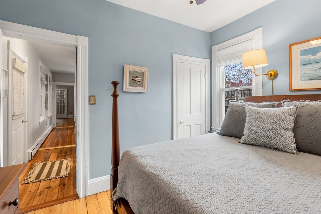 87 High Street, Unit 1 Boston, MA 02129 - Photo 8 of 18 a bedroom with a bed and a large window