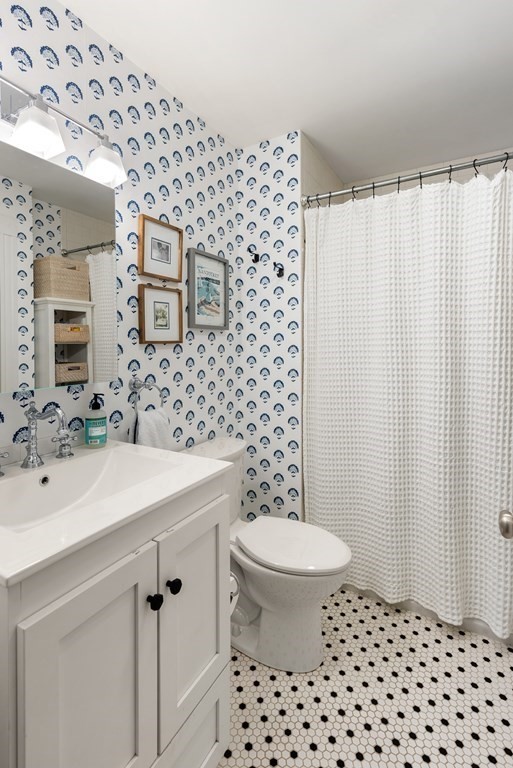 87 High Street, Unit 1 Boston, MA 02129 - Photo 9 of 18 a bathroom with a sink toilet and mirror