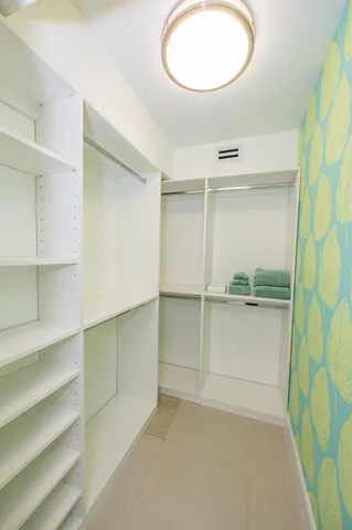 a view of an empty walk in closet