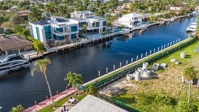 an aerial view of residential houses with outdoor space